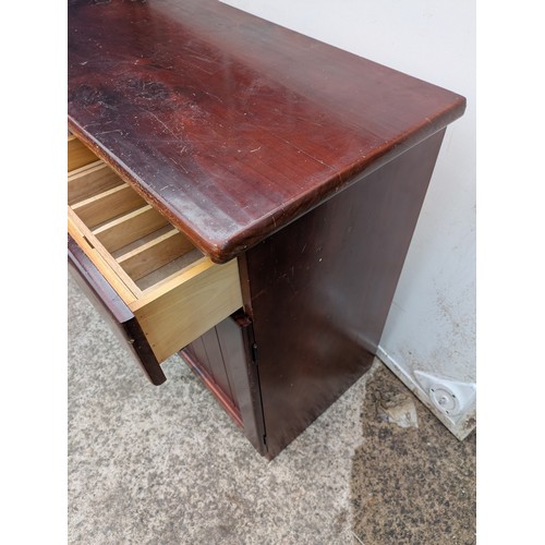 694 - A pine side unit with 4 drawers and 2 cupboard spaces