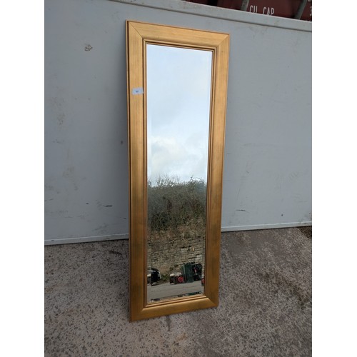 691 - A modern Bevelled edge dressing mirror in a gold guilt frame
