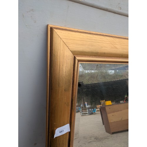 691 - A modern Bevelled edge dressing mirror in a gold guilt frame