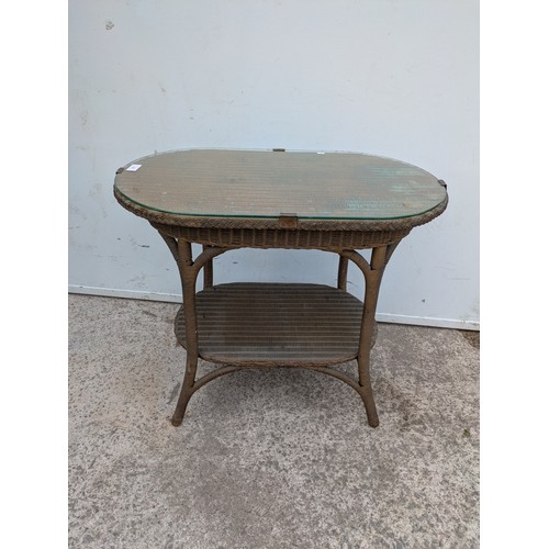 668 - A vintage genuine Lloyd loom side table with underlying shelf
