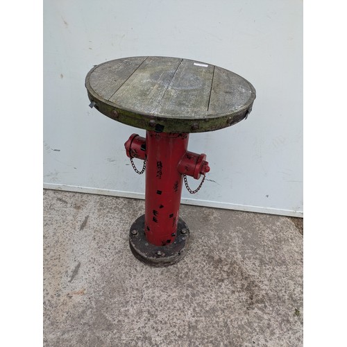 657 - A interesting table in the style of a American fire hydrant