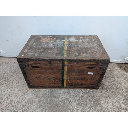 671 - An early 20th century steamer trunk with metal reinforcements