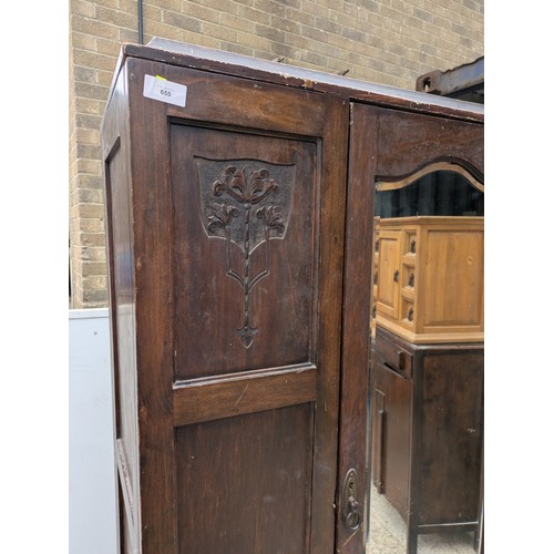 655 - A vintage mahogany wardrobe with bevelled dressing mirror