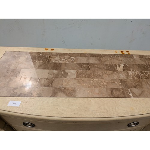 660 - A modern oak storage unit with a marble chess board style top, with drawer and cupboard space