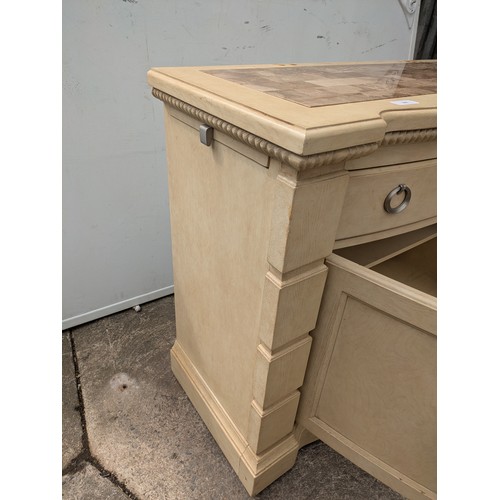 660 - A modern oak storage unit with a marble chess board style top, with drawer and cupboard space