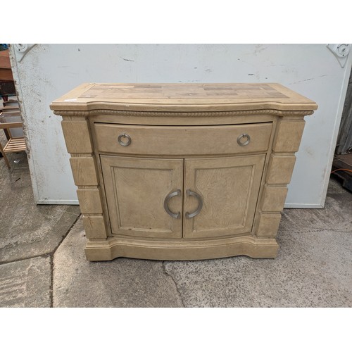659 - A modern oak storage unit with a marble chess board style top, with drawer and cupboard space