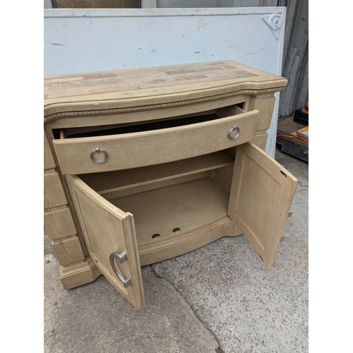 659 - A modern oak storage unit with a marble chess board style top, with drawer and cupboard space