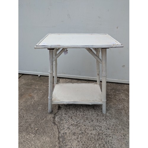 664 - A vintage bamboo side table painted white
