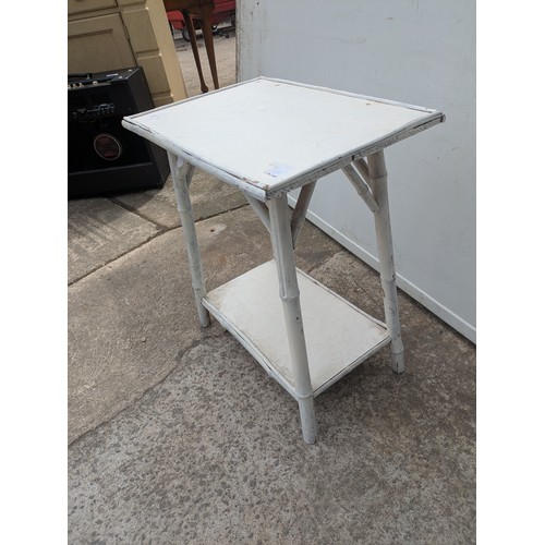 664 - A vintage bamboo side table painted white