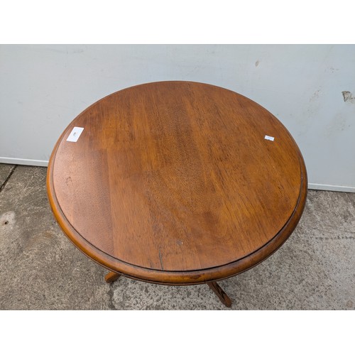 667 - A vintage oak side table with tripod base