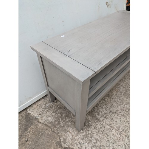 649 - A modern painted oak television stand