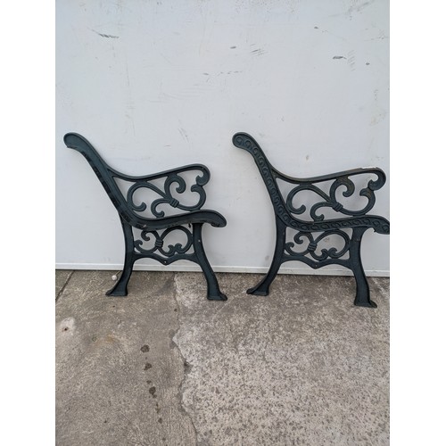 295 - A pair of cast iron bench ends