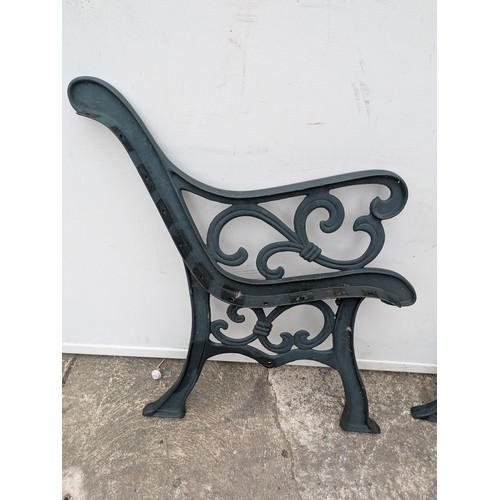 295 - A pair of cast iron bench ends