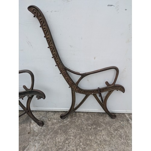 293 - A pair of cast iron bench ends