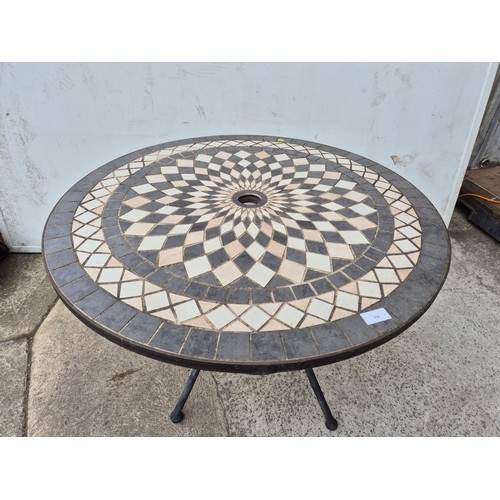 336 - A mosaic topped outdoor table