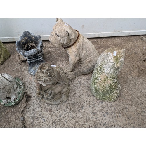 374 - A large selection of concrete garden figures
