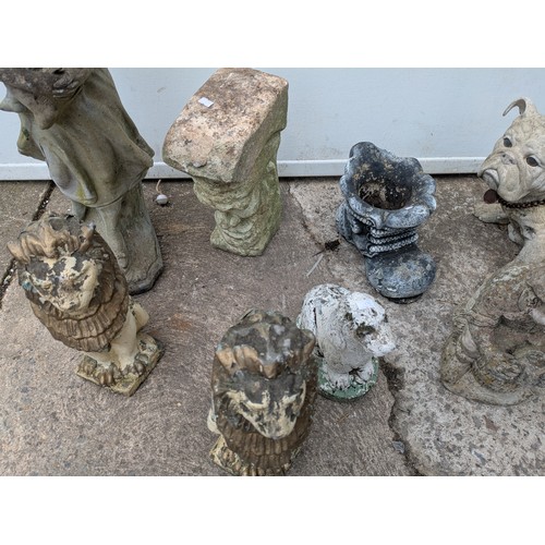 374 - A large selection of concrete garden figures