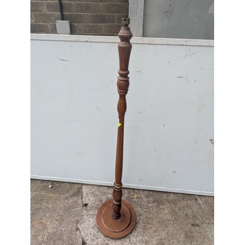 699 - A vintage oak floor standing lamp