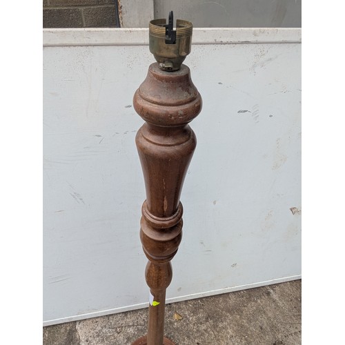 699 - A vintage oak floor standing lamp