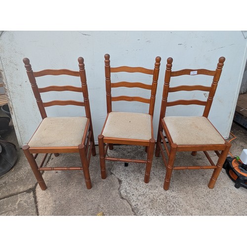 700 - Abtrio of pine dining chairs with cream seat bases