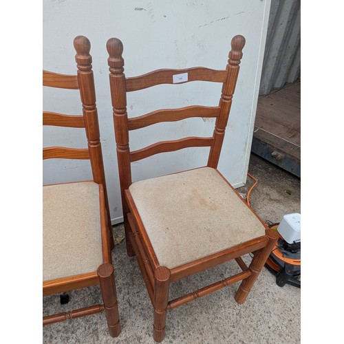 700 - Abtrio of pine dining chairs with cream seat bases