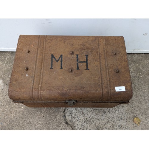 399 - A vintage metal storage trunk