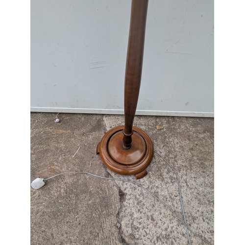 702 - A vintage mahogany floor standing lamp