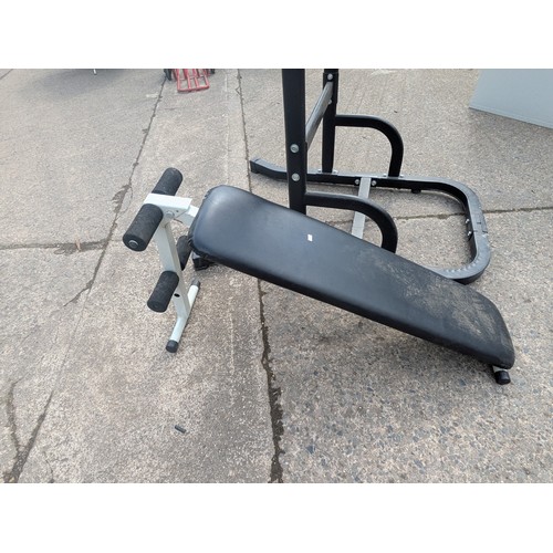 363 - A OmeTwoFit pull up and dip station with a collapsible bench