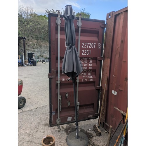 307 - A garden parasol in stand