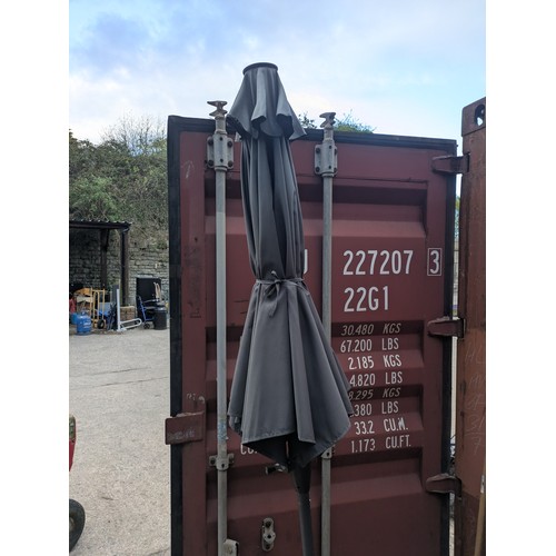 307 - A garden parasol in stand