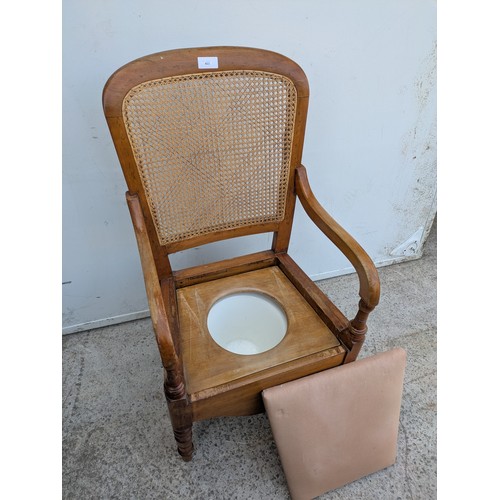 403 - A vintage wicker backed arm chair