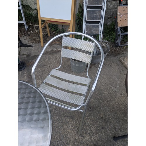309 - A polished steel outdoor bistro table with 2 chairs
