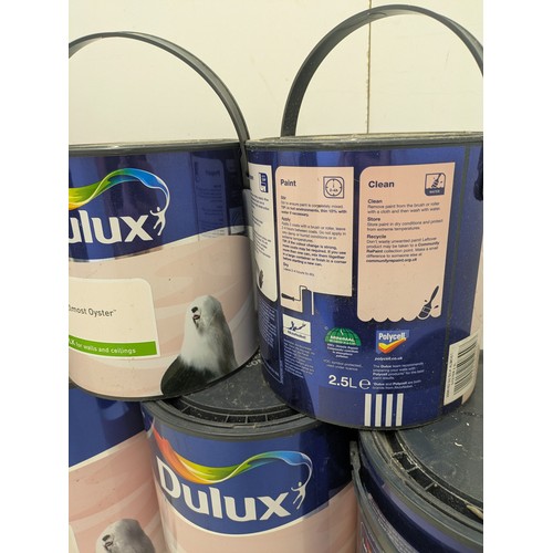 45 - A large selection of Dulux almost oyster 5 litre and 2.5 litre tins of paint