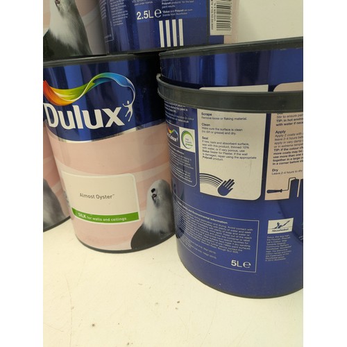 45 - A large selection of Dulux almost oyster 5 litre and 2.5 litre tins of paint