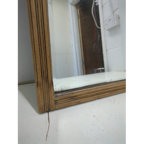 602 - A vintage carved wall mounted mirror