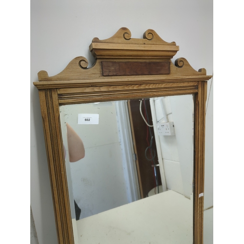 602 - A vintage carved wall mounted mirror