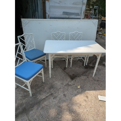 603 - A modern painted dining table with 4 matching bamboo style chairs