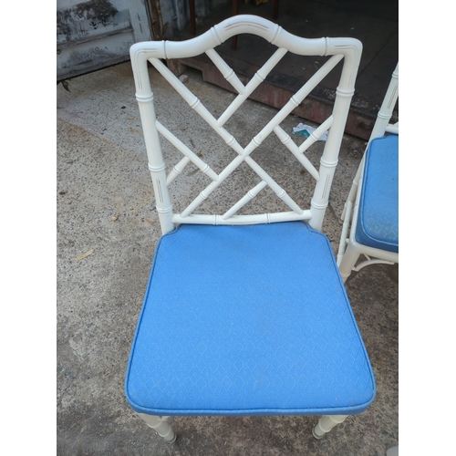 603 - A modern painted dining table with 4 matching bamboo style chairs