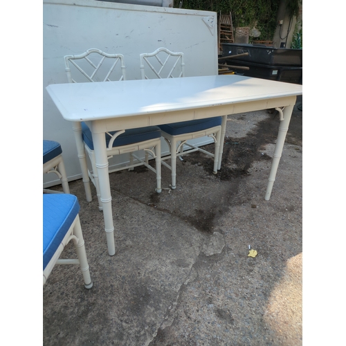 603 - A modern painted dining table with 4 matching bamboo style chairs