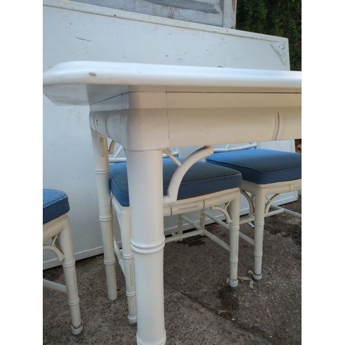 603 - A modern painted dining table with 4 matching bamboo style chairs