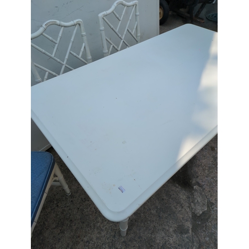603 - A modern painted dining table with 4 matching bamboo style chairs