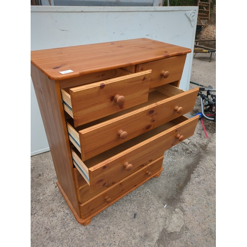 611 - A modern pine 6 drawer chest of drawers