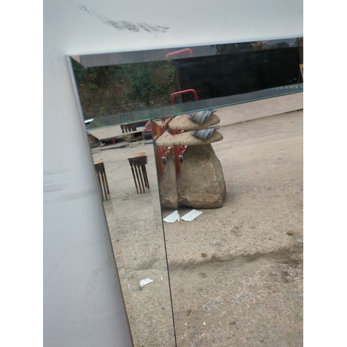 613 - A modern Bevelled glass wall hanging mirror