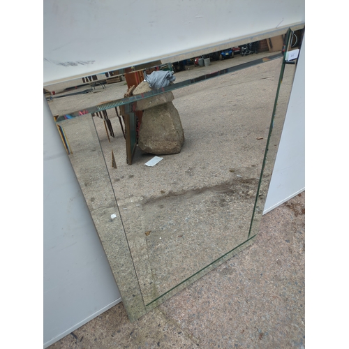 613 - A modern Bevelled glass wall hanging mirror