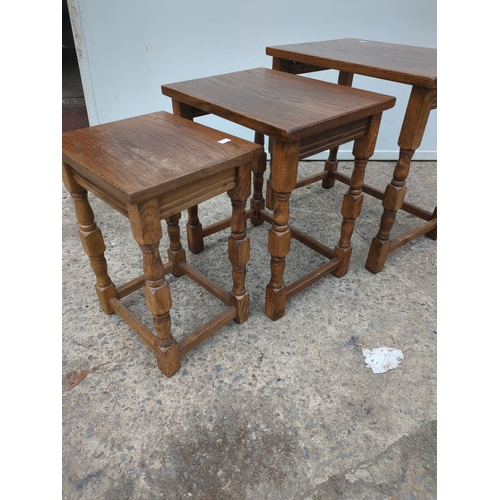 614 - A nest of 3 oak tables