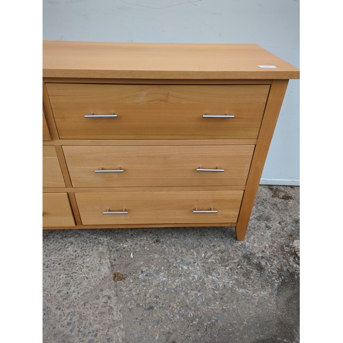 615 - A modern side unit with various cupboard and drawer spaces