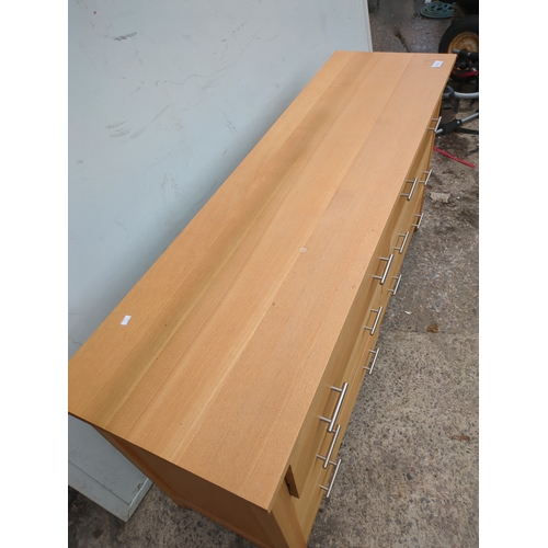 615 - A modern side unit with various cupboard and drawer spaces