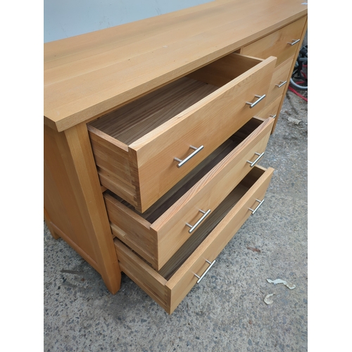 615 - A modern side unit with various cupboard and drawer spaces