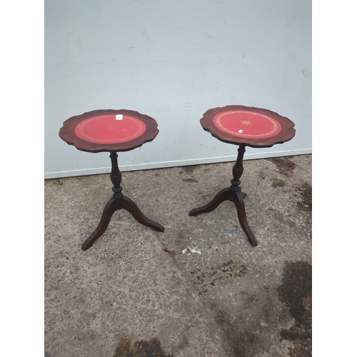 683 - A pair of leather topped mahogany side tables