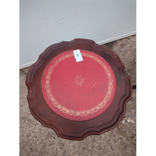 683 - A pair of leather topped mahogany side tables